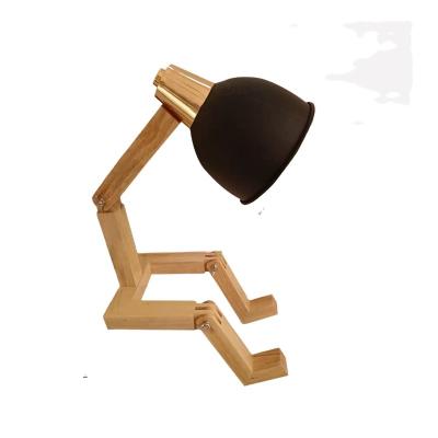 China Minimalist Amazon Hot Selling Desk Table Lamp DIY Rotating Foldable Cute Wooden Man Table Lamp For Bedroom Living Room for sale