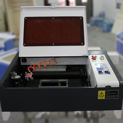 China Laser Engraving 2019 New Model 4040 Ruida Panel 50W 80W CO2 Laser Engraving Cutting Machine for sale