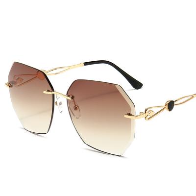 China 2022 Fashion Sunglasses Shape Metal Rimless Eyewear Vintage Oversized Women's Sun Glasses Sunglasses for sale