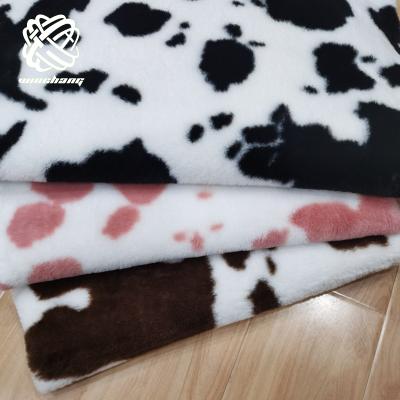 China Auto Upholstery China Manufacturer High Quality Cow Pattern Rabbit Fur Fabric Plush Fur Fabric For Garment Shoes Play for sale