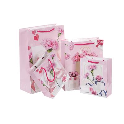 China Recyclable Small Gift Bags With Handles Pink Christmas Holiday Weddings Mini Gift Bag Happy Birthday Luxurious Paper Bag for sale