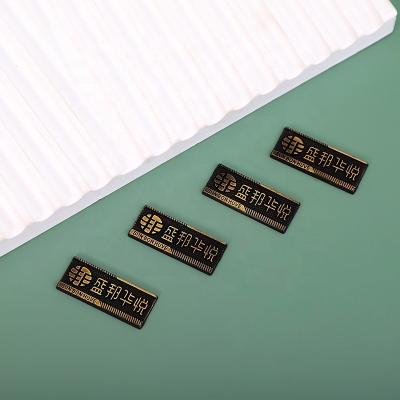 China Wholesale Custom Embossed Metal Accessories Europe Metal Label Tag Garment Logo Label Tag for sale