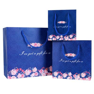 China Factory Supply Clear Pattern Floral Gift Bags Offset Printing Logo Bags Paper Custom Blue for sale