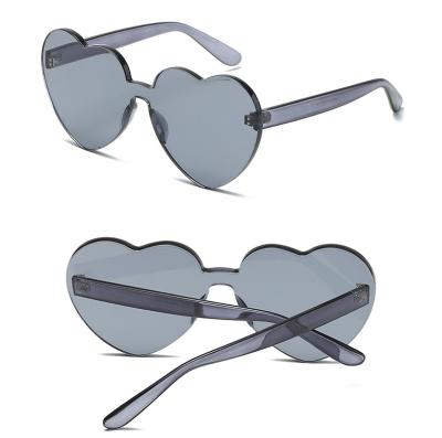 China Fashion Sunglasses Price Cheap Colorful Heart Shaped Rimless Sunglasses New Arrivals Promotional Fashion Trendy Shades Women for sale