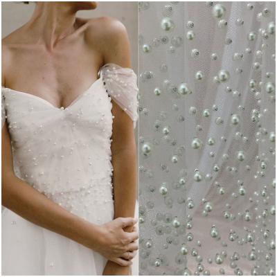 China Viable Hot Selling White Heavy Bead Tulle Lace Up High Quality Wedding Dress Party Dress Lace Fabric Material for sale