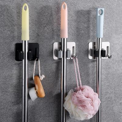 China Multi-Functional Wall Mounted Durable Stainless Steel Broom and Broom Holder Bathroom Kitchen Broom Mop Holder for sale