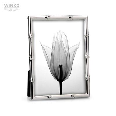 China Latest Silver Plated Oriental Bamboo Design 10X15Cm Family Memorabilia Design Metal Photo Frame for sale