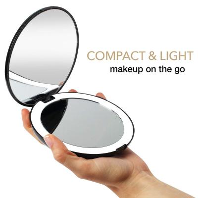 China Custom Lighted 2 Sides LED Lighted Small Makeup Compact Pocket Cosmetic Folding Mirror for sale