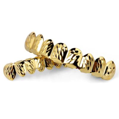 China Cheap Brass Hiphop Gold Teeth Grillz Real Top And Bottom Grillz Set High Quality Hitter Hip Hop Mens Body Jewelry for sale