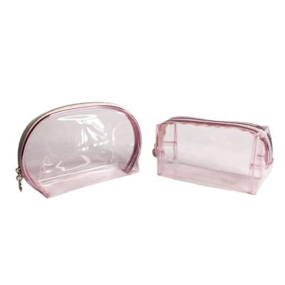 China Fashoion hot sale pink color round shape half small transparent tpu travel makeup cosmetic bag for sale