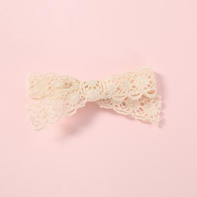 China Hair ornaments sell hair accessories hairpin children hairpin one color cloth word hollow flower bow girl sheer side clip for sale