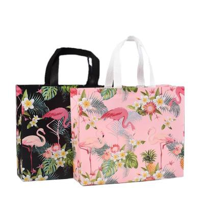 China Low MOQ Eco-friendly Lovely Stock Colored Black Pink Bird PP Non Woven Bag Shopping Tote Bag for sale