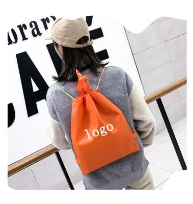 China Custom Logo Portable Non Woven Drawstring Backpack Eco-friendly Shopping Bag Nonwoven Bag Drawstring Backpacks Bag With Handles for sale