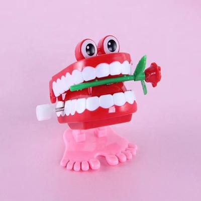 China Easy Operation Dental Gift Plastic Children's Wind Toys Craft Jumping Teeth For Halloween Funny for sale