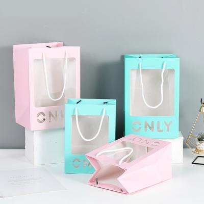 China Recyclable LOVE Valentine's Day Gift Flower Cute Flower Bag Pink Blue Shopping Paper Bag With Heart Window for sale