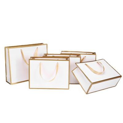 China Recyclable Exquisite Biodegradable Portable White Gift Bags Square Bottom Matt With Gold Edge Shopping Shoes Paper Bag For Clothing for sale