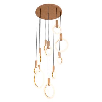 China New creative modern villa stairwell art LED wood chandelier modern dinning room bedroom log ring duplex building chandelier for sale