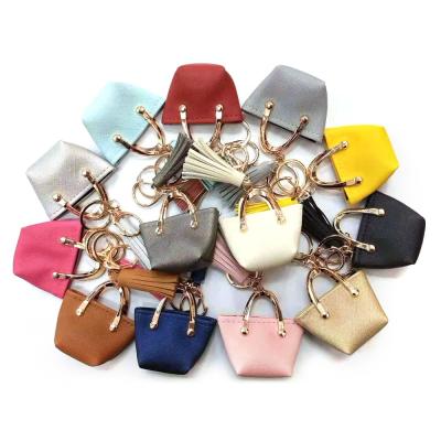 Cina OEM 35g Brown Mini Purse Keychain, catena chiave del piccolo sacchetto di cuoio della moneta dell'unità di elaborazione in vendita