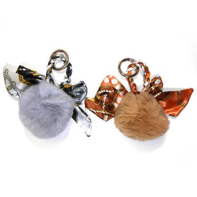 China OEM 15x8cm Pom Pom Brown Fur Ball Keychain Gegraveerd Embleem Te koop