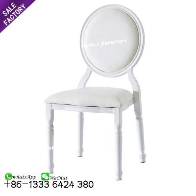 China Modern popular special design white metal luxury stackable round back dining wedding chairs for banquet for sale