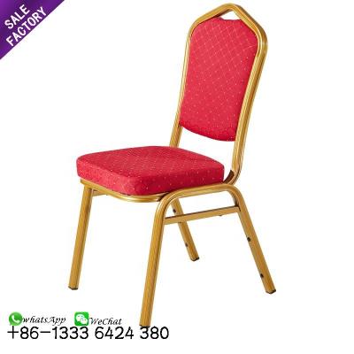 China Cheap Modern China Hotel Supply Gold Price Furniture Gold Metal Steel Frame Red Fabric Red Fabric Stackable Wedding Chair for sale