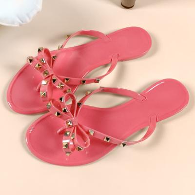 China Durable Hot Women Flip Flop Slipper For Wholesale Black Summer Beach Rivet Sale for sale