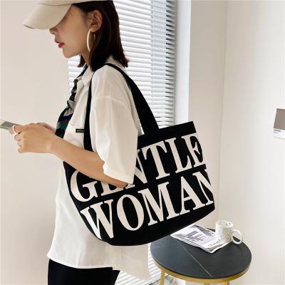 China 2022 New Tote Women's Fashion Printed Letters Hand-held Shopping Canvas One Shoulder Tote Bag for sale