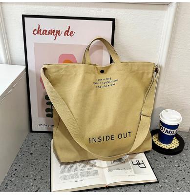 China 2022 Japanese Casual Single Oblique Cross Cloth Bag Large Capacity Student Tote Portable Canvas Bag for sale