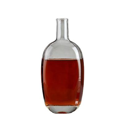 China Hot Clear Round High End Customizable Household Products Factory Price Glass Bottle Vodka Whiskey Bottle With Cork for sale