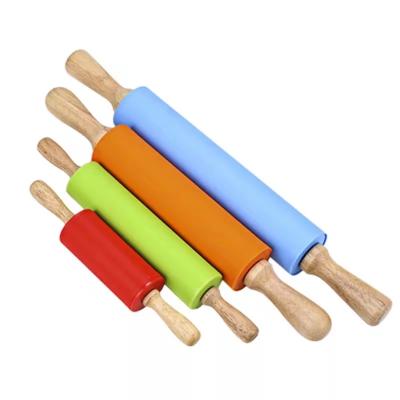 China Innovative Viable Kitchen Tools Silicone Rolling Pin With Wooden Handle for sale