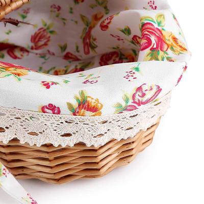 China Traditional Hot Sale Wicker Handmade Round Basket With Handle Flowers Fruits Bread Picnic Gift Storage Basket for sale