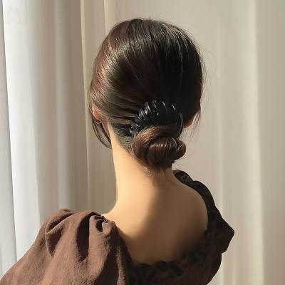 China Fashionable Expanding Bun Hair Clip Decorative Hair Clips Plastic Women Shape Leopard Adjustable Hairpin for sale