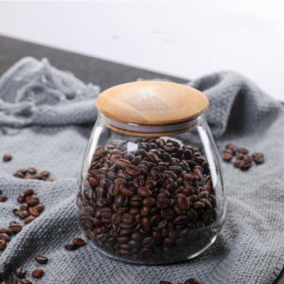 China Viable custom logo 400ml 900ml food glass jar bottles lid wooden airtigh glass jar container with bamboo lid for food for sale