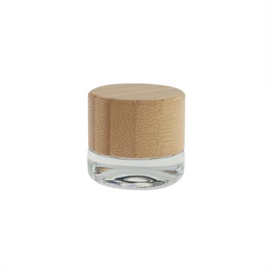 China Essential Oil Screw Cap Dab Jar Child Resistant Bamboo Lid Jar 3ml 5ml for sale