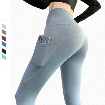 China Breathable Quick Dry Yoga Pants Boot Cut Out Women Gaiters With Back Pockets Seamless Yoga Panties With Pocket for sale