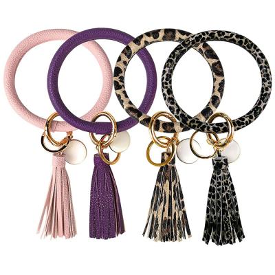 China Religious PU Leather Bracelet Bangle Key Chain Bracelet Around Key Ring Large Circle Tassel Key Holder Chain Bracelets For Women Girls for sale