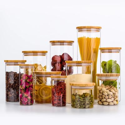 China Freshness Keeping Classic Kitchen Storage Cylinder Glass Bottle Spices Storage Glass Storage Jar With Bamboo Lid for sale