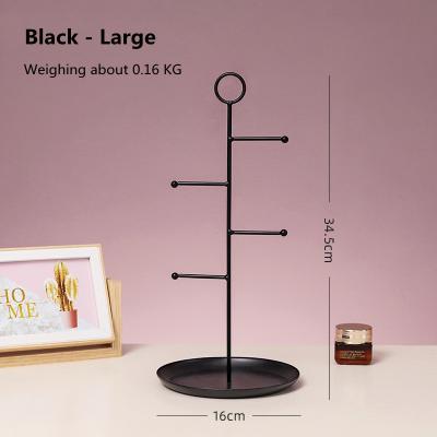 China Contemporary simple and creative iron art round tray bracket jewelry rack girl bedroom makeup room earrings jewelry rack for sale