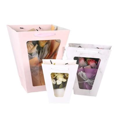 China New Gift 2022 Recyclable Wholesale Flower Tote Bag Flower Open Window Trapezoidal Transparent Paper Bag for sale