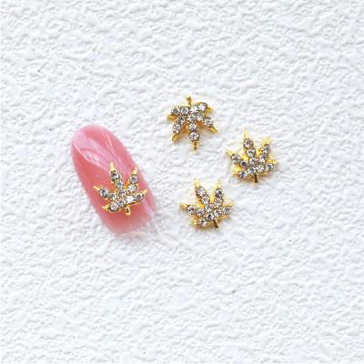 China Fashionable Wholesale Leaves Shape Nail Art Decorations Gold Plating Alloy Zircon Nail Charm for sale