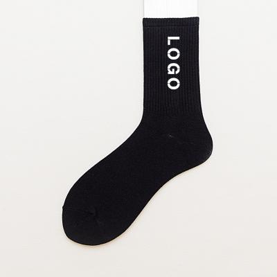 China Viable Designer Custom Made Male Letters Logo Socks Cotton Crew Black And White Sports Socks for sale