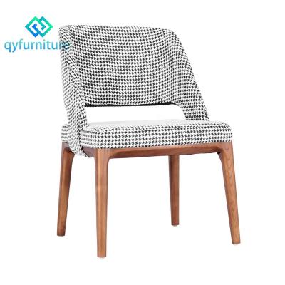 China Durable Modern Cafe Furniture Upholstered Fabric Dining Chairs With Wooden Legs for sale