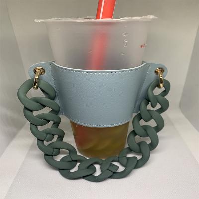 China Viable hot sale and new product coffee cup sleeve PU leather coffee cup sleeves holder with acrylic chains travel cup sleeves for sale