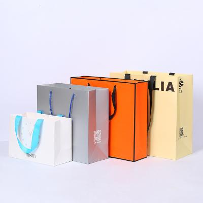 China Luxury Bolsa De Papel Recycled Packaging Paper Bag Materials Custom Boutique Shopping Gift Retail Paper Bag For Clothing Shoes for sale