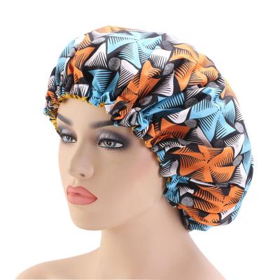 China Hot Selling Comfy Fancy Beauty Comfy Satin And African Hair Care Hat Batik Printing 2 Layers Around Hood With Adjustment Drawstring Buckle for sale