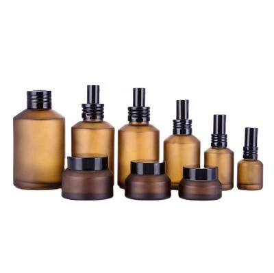 China Luxury Cosmetic Packaging 15/30/50/100g 30/60/100 120/200ml Frosted Amber Glass Pump Bottle And Cream Jar For Cosmetics Skin Care Packaging Set for sale