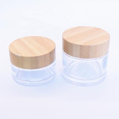 China Wholesale Clear Round Personal Care Skin Care Packaging Cosmetic 30g 50g Jar For Face Cream Sets With Bamboo Cap for sale