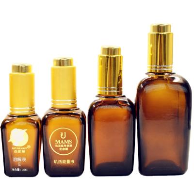 China Fancy 30ml 50ml 100ml Personal Care Empty Square Amber Glass Dropper Bottle With Gold Pump for sale