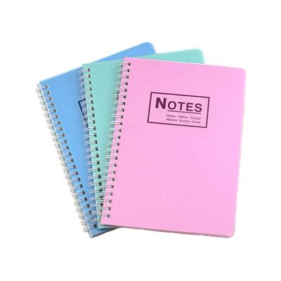 China Easy Writing Plastic Material PVC Sheet Hard Vinyl PP Clear Cover Spiral Coil A4 Practice Binding Ring Notebook School Logo With Yellow Paper for sale