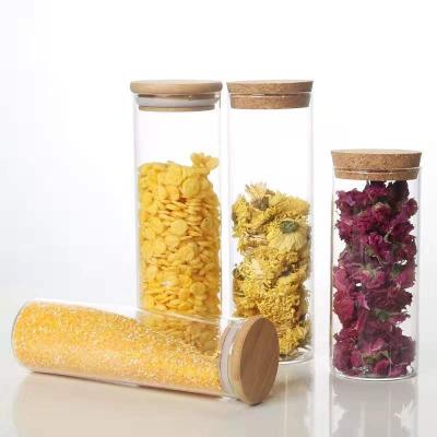 China Sustainable airtight hot sale high borosilicate glass jar for kitchen storage dry food with bamboo lid and cork lid for sale